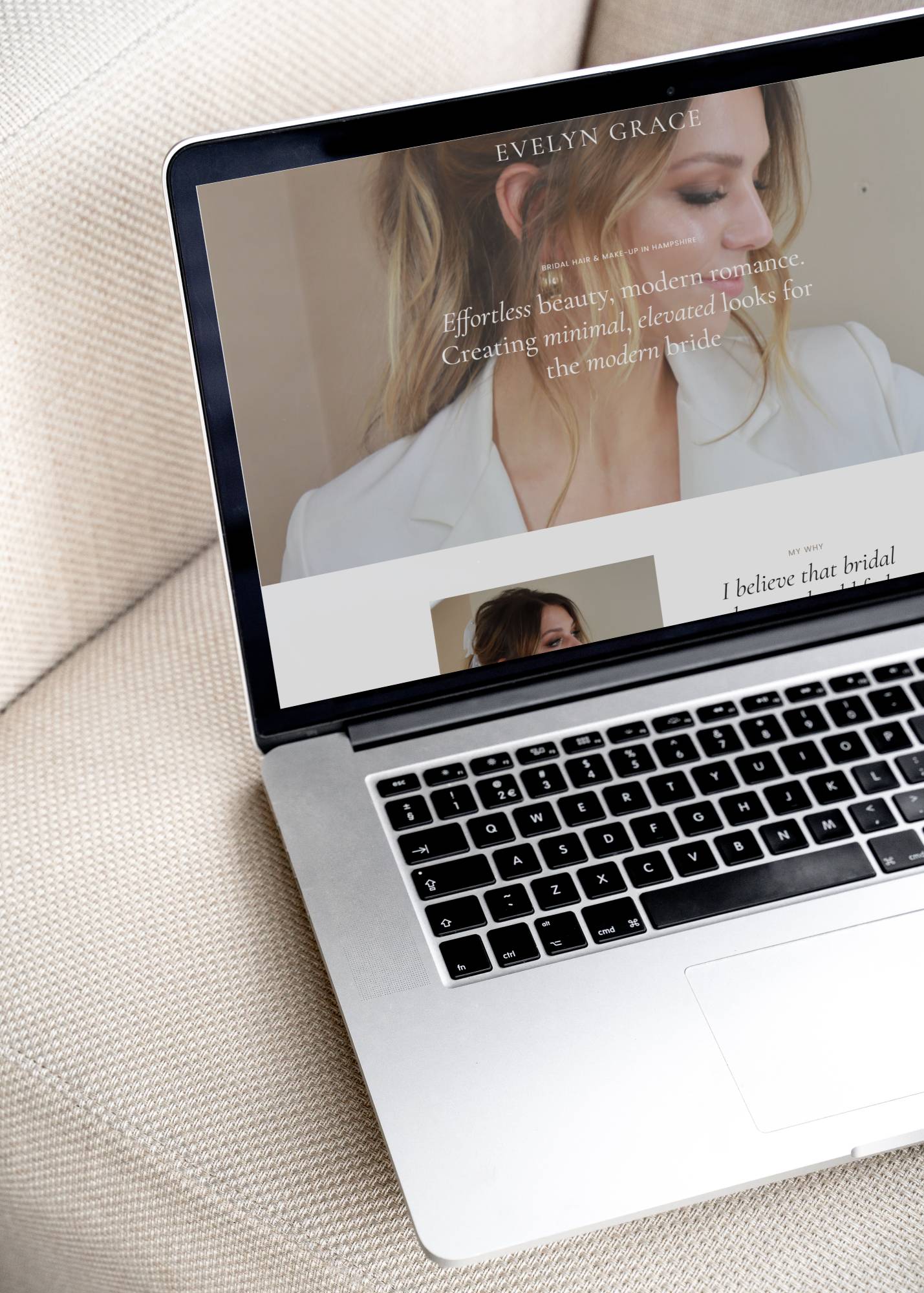 Mockup of a laptop with a bridal hair & makeup artist website on the screen.